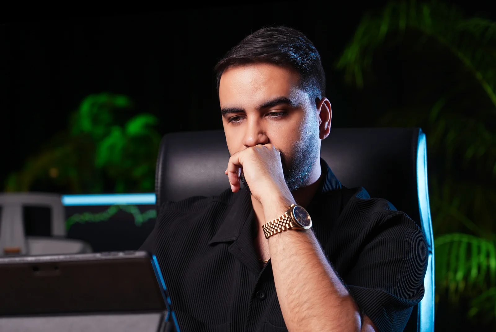 Mohammad Ahangari Asl, owner of Ahangari Holding, at his trading desk