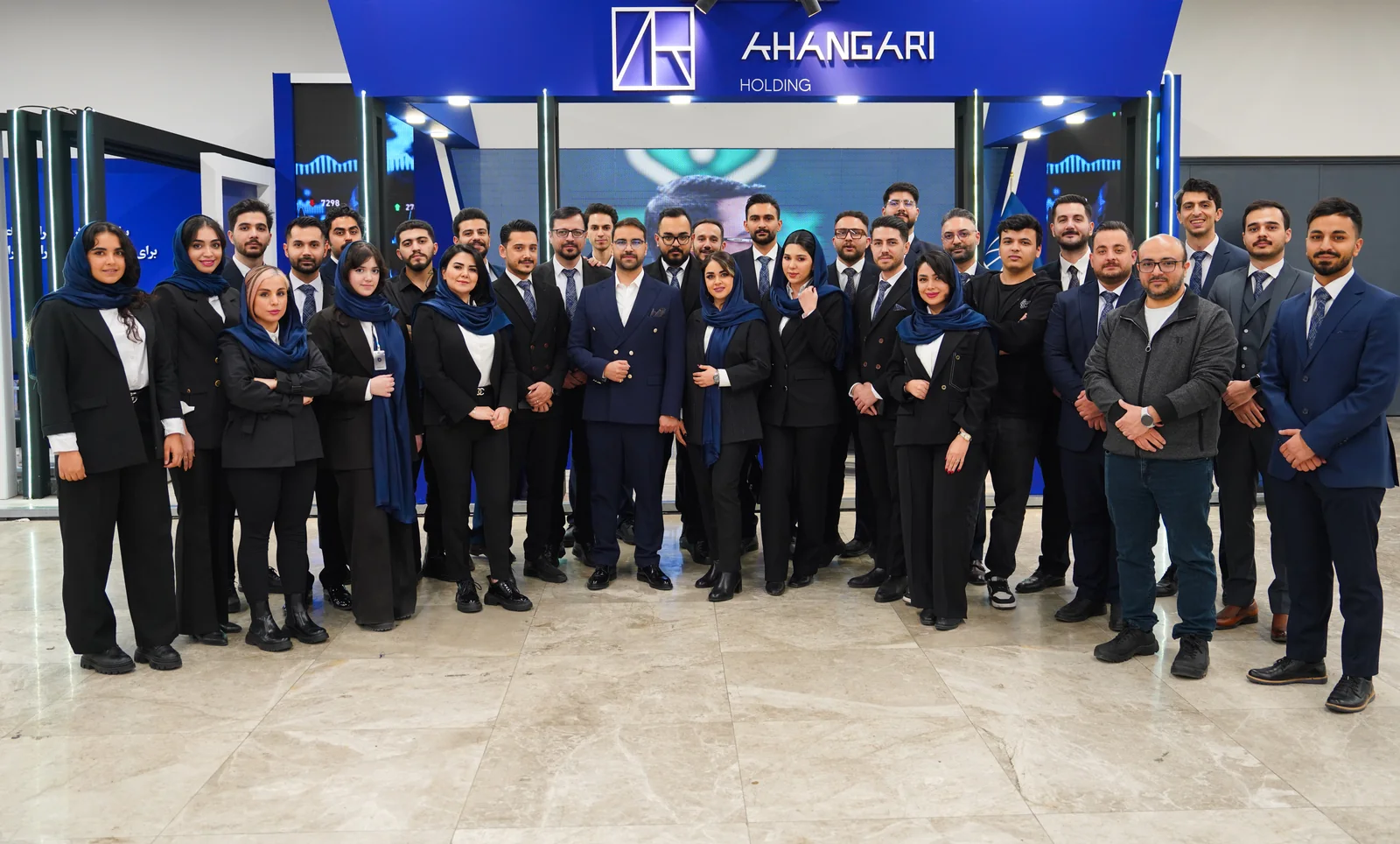 Mohammad Ahangari Asl with the Ahangari Holding team at their exhibition booth