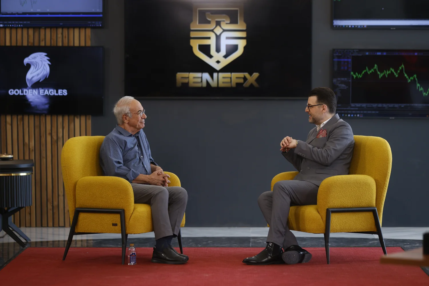 Mohammad Ahangari Asl in conversation with a guest at House of Traders